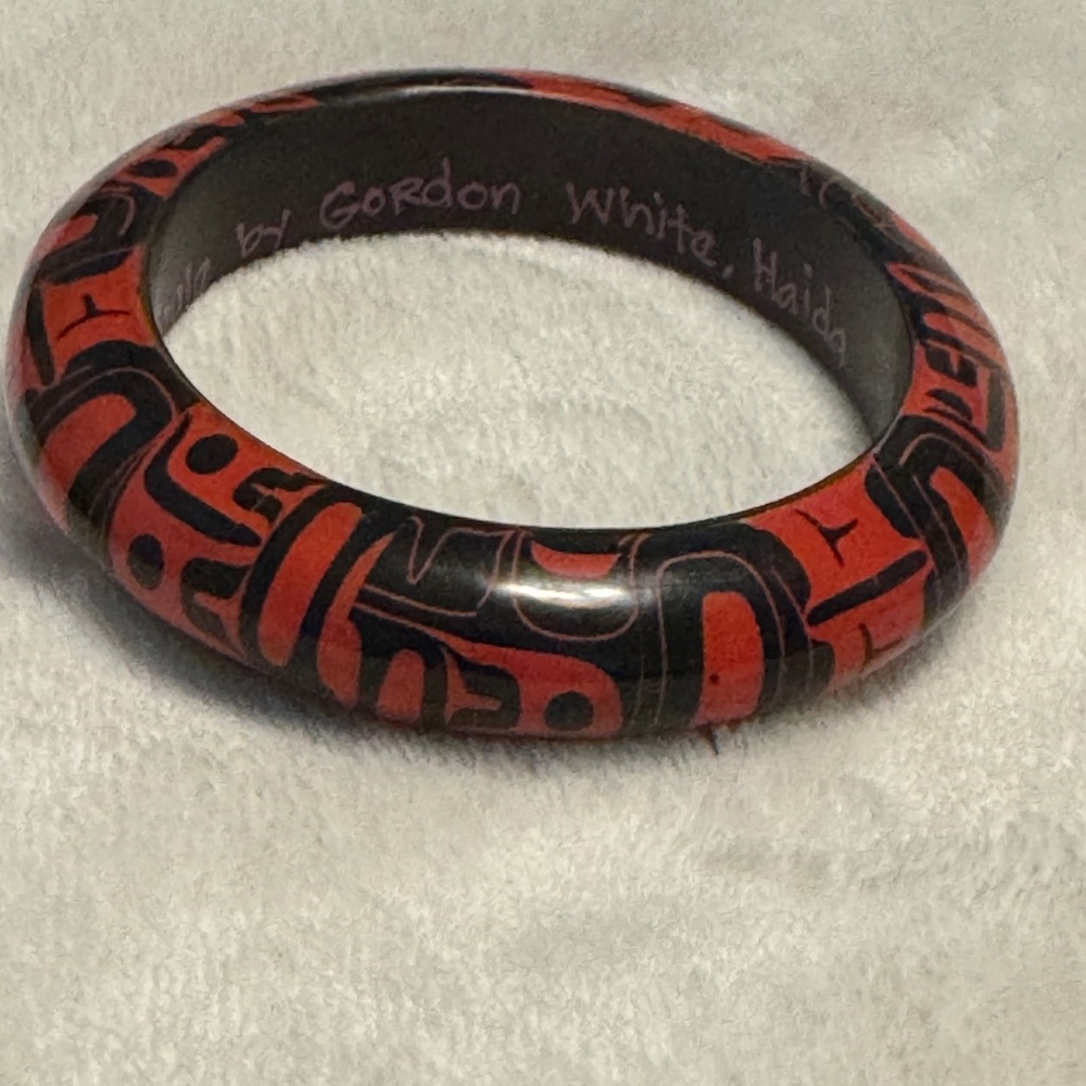 Haida artist designed red and black bangle